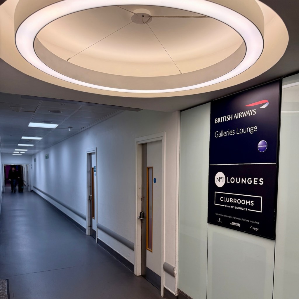 Entrance to the British Airways Galleries Lounge at Heathrow Terminal 3, featuring signage and a well-lit corridor.
